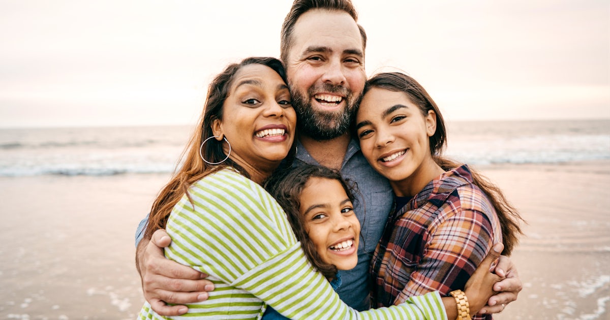Smiling parents with two children